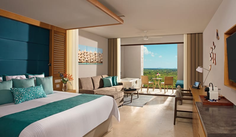 DREAMS PLAYA MUJERES JUNIOR SUITE GARDEN VIEW BEDROOM